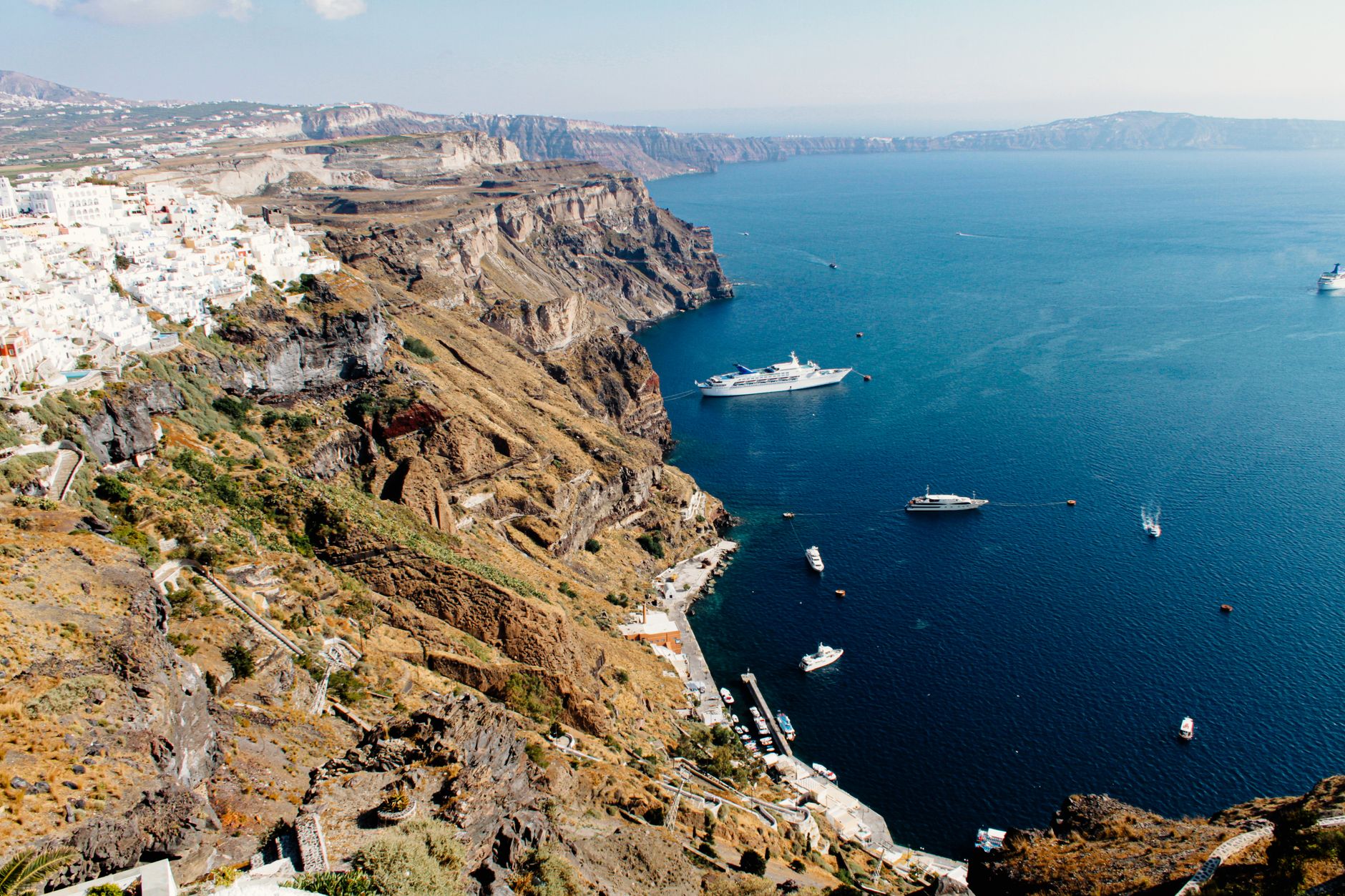 Santorini’s white villages above the blue Aegean and volcanic caldera